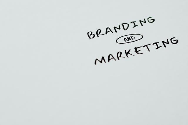 The words branding and marketing against a blank background representing an important aspect for independent consultants.